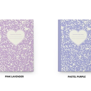 May include: Two composition notebooks with a heart-shaped design. The notebook on the left is pink lavender and the notebook on the right is pastel purple. Both notebooks have the text "Composition Book" printed on the front.