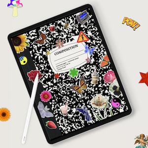 May include: A black and white composition notebook with a variety of colorful stickers, including butterflies, flowers, and a yin yang symbol. The notebook is on a white surface with a white stylus next to it.