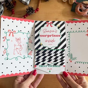 May include: A Christmas-themed greeting card with a festive design. The card features a reindeer illustration, the text "Season's Surprises Inside", and the phrase "Treat Yourself". The card has a red and white color scheme with black polka dots.
