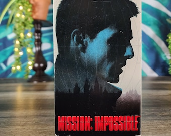 Mission: Impossible VHS, stars Tom Cruise, Ethan Hunt (Cruise) Seeks to Uncover the Truth Behind the Murders of His IMF Team