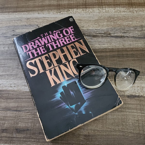 The Drawing of the Three Novel, by Stephen King, Oversized Paperback Book, Interweaving Dark Evocative Fantasy with Gritty Realism