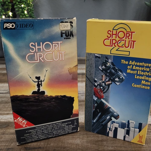 Short Circuit VHS, stars Ally Sheedy and Steve Guttenberg, & Short Curcuit 2 VHS, stars Fisher Stevens, Michael McKean and Cynthia Gibb