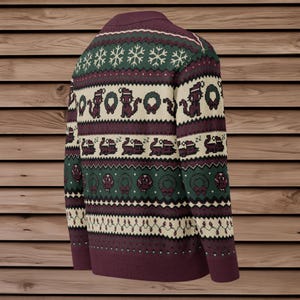 May include: Burgundy Christmas sweater with a festive pattern. The design includes snowflakes, wreaths, and pixelated images of cats wearing Santa hats. The sweater has a ribbed neckline, cuffs, and hem, and is made of a soft knit material.