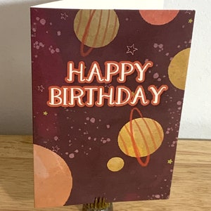 Carte d'espace de joyeux anniversaire, imprimée, vide à l'intérieur, planètes, atmosphère, étoiles, consolations