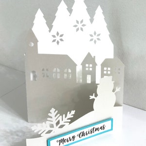 Carte d'accordéon Joyeux Noël Village , Vierge à l'intérieur , Neige , Bonhomme de neige , Église , Maison
