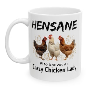 May include: White ceramic mug with the text "HENSANE" in black, above an illustration of three chickens. Below the chickens is the text "Also known as Crazy Chicken Lady".