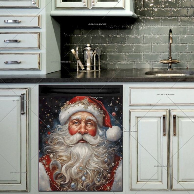 May include: A dishwasher magnet featuring a close-up portrait of Santa Claus with a red hat and white beard. The background is a dark blue with white snowflakes.