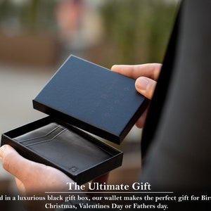 May include: A black leather wallet in a black gift box. The Ultimate Gift. Packed in a luxurious black gift box, our wallet makes the perfect gift for Birthdays, Christmas, Valentines Day or Fathers day.