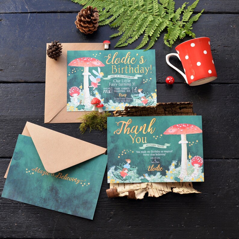 May include: Two green and gold fairy-themed thank you cards with illustrations of fairies and mushrooms. The text on the cards reads "Elodie's Birthday!" and "Thank You".