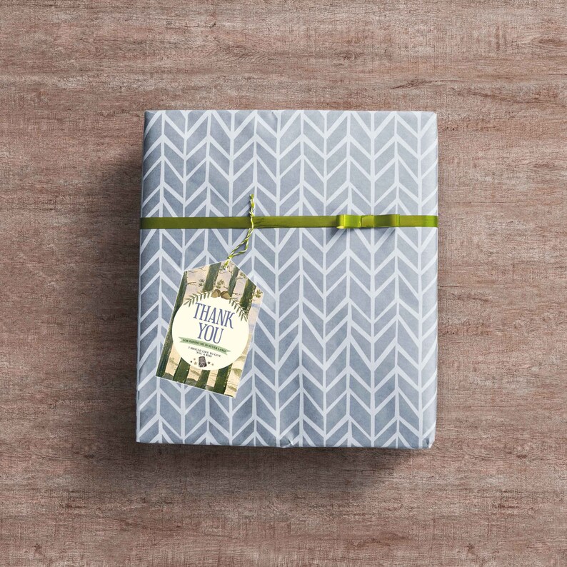 May include: A gray gift box with a chevron pattern wrapped with a green ribbon and a gift tag that says "Thank You".