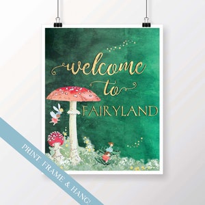 May include: A green watercolor background with gold lettering that says "welcome to FAIRYLAND". There is a large red and white mushroom with white spots and a smaller red and white mushroom with white spots. There are two fairies flying near the mushrooms and two fairies sitting on a large green beetle.