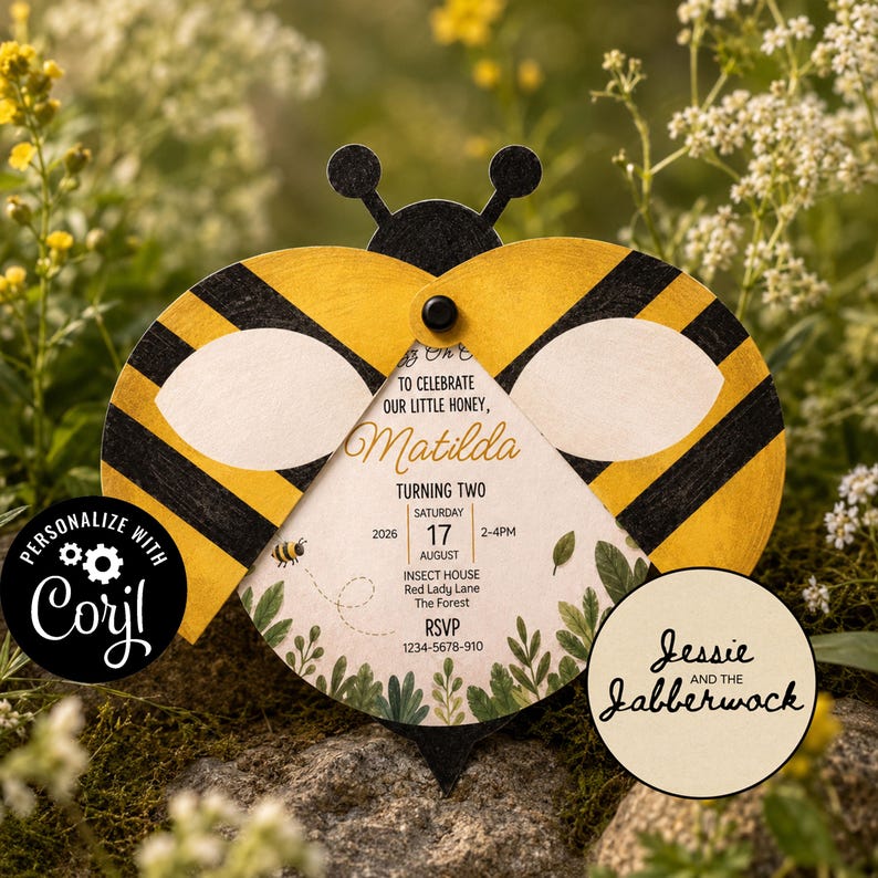 May include: A bee-shaped invitation card with yellow and black striped wings, featuring text that reads: To celebrate our little honey, Matilda, turning two, Saturday 17 August 2026, 2-4PM, Insect House, Red Lady Lane, The Forest, RSVP 1234-5678-910.