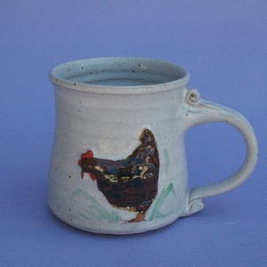 Hand thrown stoneware Mug, cup with raised chicken motif