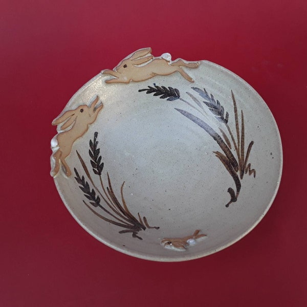 Decorative bowl with leaping hare design,  approx 20cm dia, handthrown stoneware pottery ceramic.