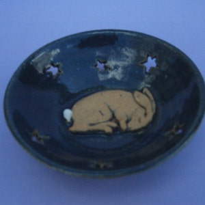 Hand thrown stoneware dish with sleepy hare and cutout stars