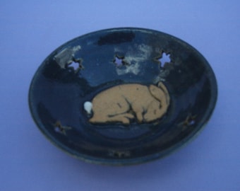 Hand thrown stoneware dish with sleepy hare and cutout stars