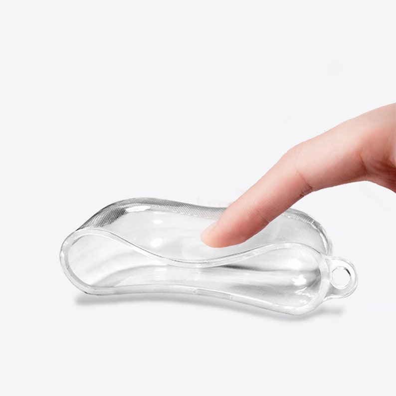 May include: A clear plastic case with a flexible design. The case is designed to hold small items, such as earbuds or a small phone.