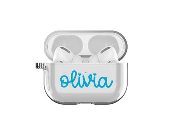 May include: White Airpod case with a clear cover and the name "olivia" written in blue cursive with two small hearts above the name.