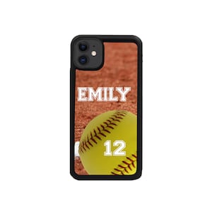 May include: Black phone case with a softball and the name "EMILY" and the number "12" on it.