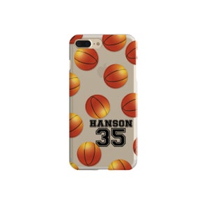 May include: A clear phone case with a pattern of orange basketballs. The text "HANSON 35" is printed in black on the case.