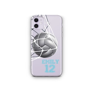 May include: A purple phone case with a white volleyball in a net and the text "EMILY 12" in blue.