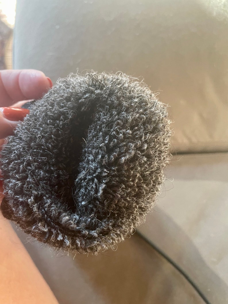 May include: A gray fuzzy scrunchie for hair.