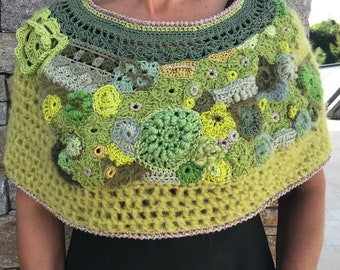 Green-tinted freeform crocheted shoulder warmers