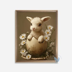 May include: A framed print featuring a lamb emerging from a cracked egg, surrounded by daisies. The lamb has fluffy white fur and large, expressive eyes. The egg is a cream color with a floral pattern. The artwork is set against a neutral background.