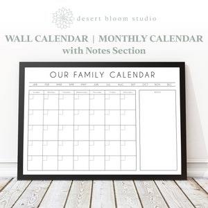 May include: A black framed calendar with the title "Our Family Calendar" and a monthly calendar grid with a notes section on the right side.