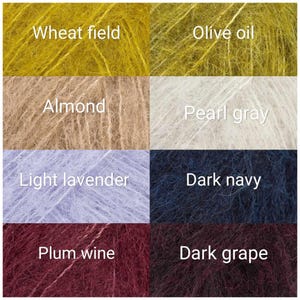 May include: A grid of eight fuzzy yarn samples in various colours labelled Wheat field, Olive oil, Almond, Pearl gray, Light lavender, Dark navy, Plum wine, and Dark grape. Each square displays a textured, fibrous material with a soft, haloed appearance.