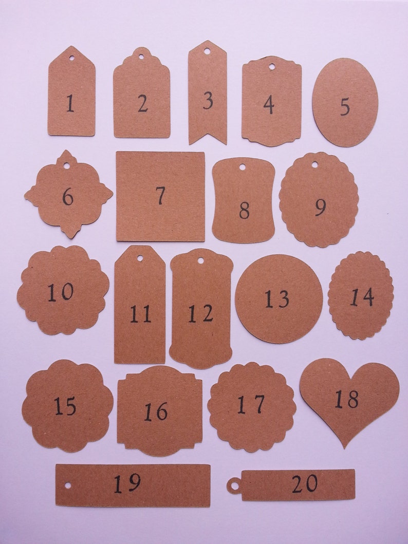 May include: Twenty brown paper gift tags with different shapes and sizes. The tags are numbered 1 through 20.
