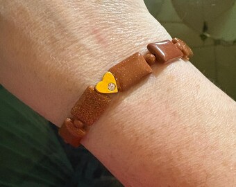 Sparkly Goldstone Bracelet: Rectangular Beads with Gold Heart Charm