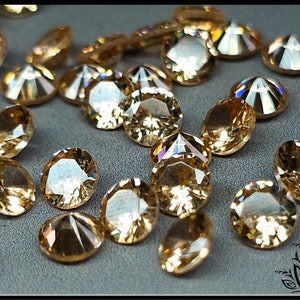 Glass crystal - Peach - 5 mm - round faceted cut
