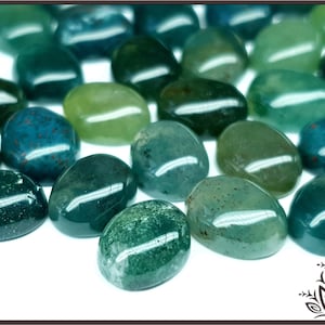 May include: A collection of smooth, oval-shaped green and blue agate stones. The stones have a polished finish and are arranged on a white surface.