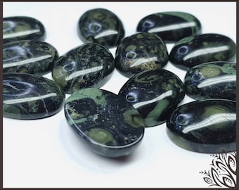 May include: A collection of polished, oval-shaped dark green stones featuring mottled patterns of black and lighter olive green inclusions. Each stone has a smooth, reflective surface with visible light highlights, showcasing a natural, variegated appearance.