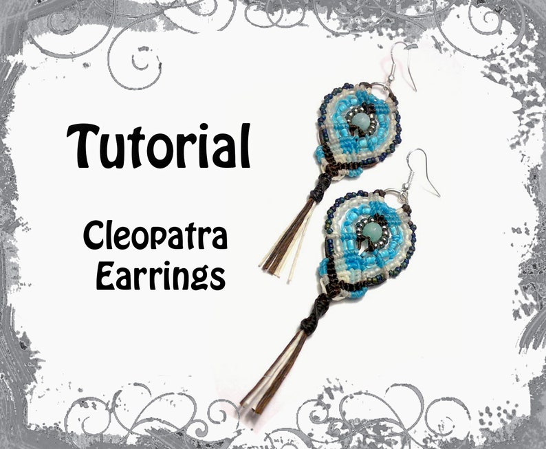 May include: A pair of Cleopatra earrings with a macrame design in shades of blue, white, and black. The earrings have a central bead and dangling tassels. The word "Tutorial" and "Cleopatra Earrings" are written in black text.