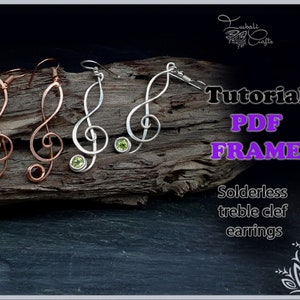 May include: Three pairs of treble clef earrings, one pair in silver with green stones, one pair in copper with red stones, and one pair in copper with red stones. The earrings are displayed on a piece of driftwood. The image includes the text "Tutorial PDF FRAME Solderless treble clef earrings".