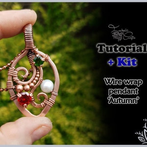May include: A copper wire wrapped pendant featuring a red gemstone, a green gemstone, and a white pearl. The text reads: Lubali Crafts, Tutorial + Kit, Wire wrap pendant 'Autumn'. The pendant has a swirling metal design and a copper ball chain.