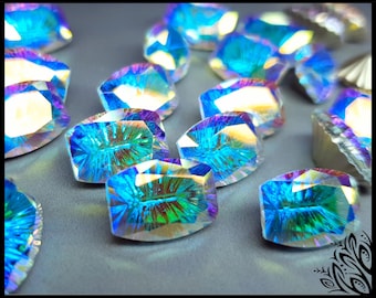 May include: A collection of faceted, oval-shaped glass cabochons featuring an iridescent finish that reflects vibrant shades of blue, green, and purple. Each piece displays a clear, multi-faceted surface with a radiant, light-catching quality.