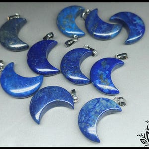 May include: Ten crescent moon shaped lapis lazuli pendants with silver bail loops. The pendants are a deep blue colour with white and gold flecks.