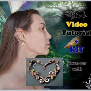 May include: A video tutorial and kit for making elven ear cuffs. The image shows a model wearing a pair of copper wire ear cuffs with green gemstones. The cuffs are shaped like leaves and have a delicate, intricate design. The image also includes text that says "Video Tutorial + KIT Elven ear cuffs".