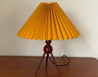 Mid-century modern Danish solid teak three legged table lamp / tripod by Severin Hansen, with a new ochre yellow linen knife pleated shade.