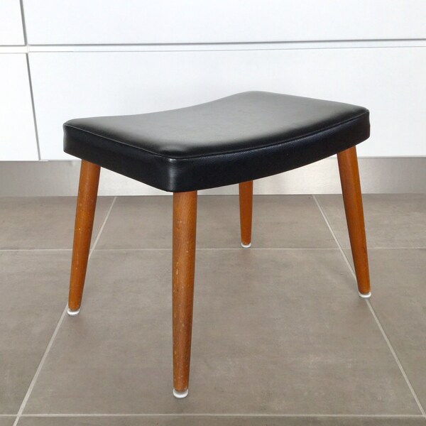 Mid-century teak and black artificial leather stool. Danish modernist design.
