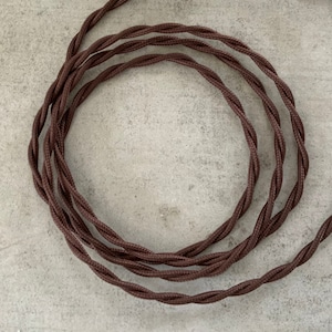 May include: Brown twisted electrical cord, perfect for adding a vintage touch to your home decor projects.