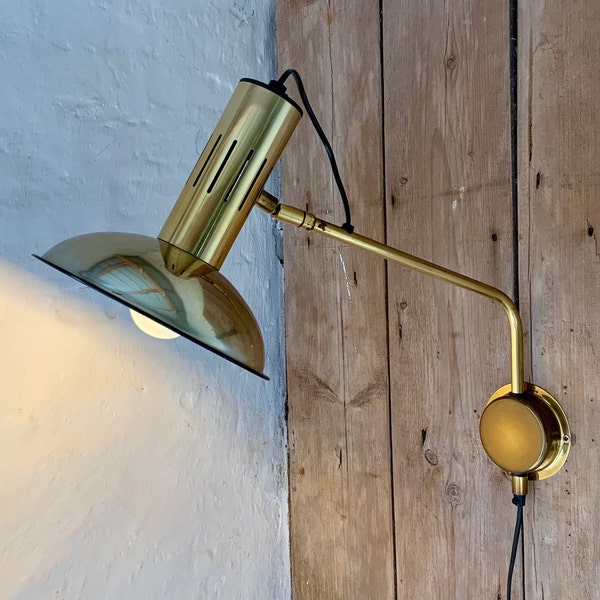 Vintage 1970s Danish brass swing arm wall lamp.
