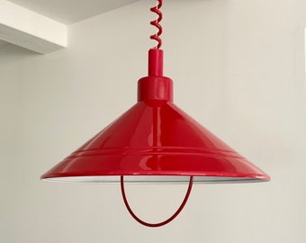 Cherry red "rise and fall" pendant lamp / hanging light in red with rise and fall mechanism and coiled cable. Made by E.S. Horn, Denmark.