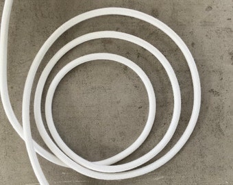 White woven, round textile covered cable, fabricated in Italy