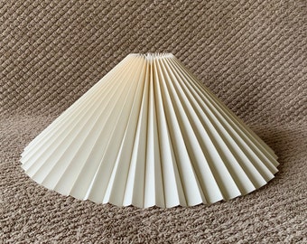 Clip on shade: Cream linen, pleated lampshade, available in two styles, for table lamps/wall lights. Danish designed.