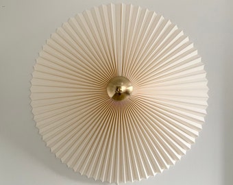 Large Danish designed rosette wall light, choice of shade fabric and voltage. Solid natural brass centre finial.