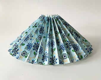 Clip on shade: Blue floral pattern on pale blue, cotton pleated lampshade, for table lamps/wall lights. Danish design.